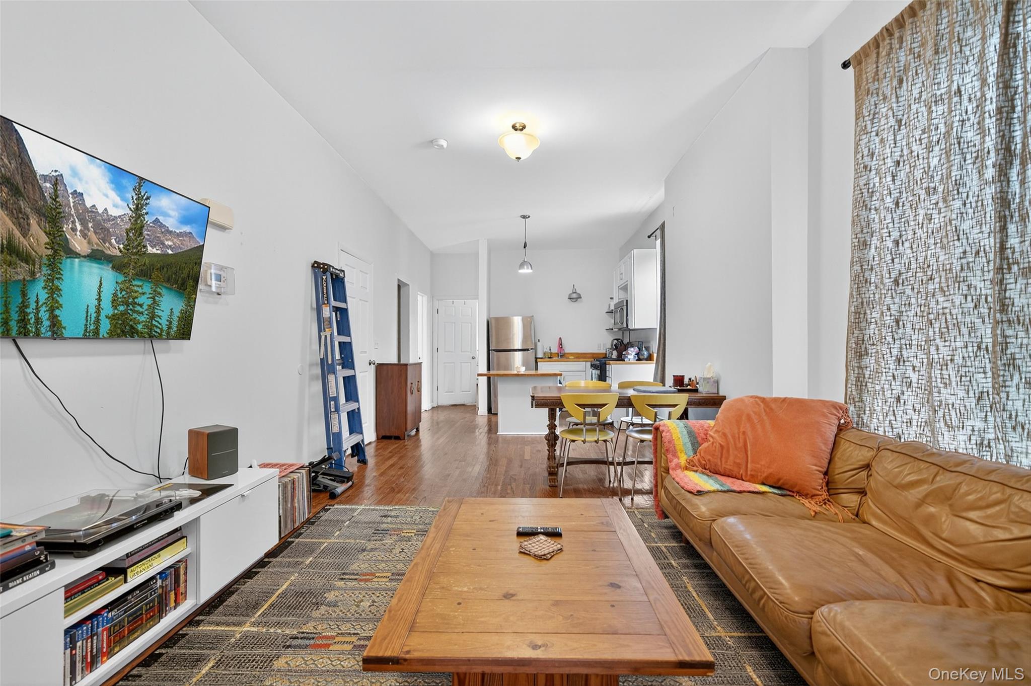 153 Lander Street Newburgh, NY 12550 - Photo 29 of 39 a living room with furniture and a flat screen tv