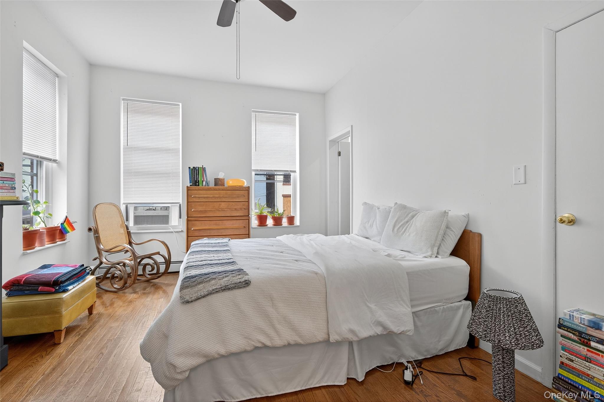 153 Lander Street Newburgh, NY 12550 - Photo 30 of 39 a bedroom with a bed and wooden floor