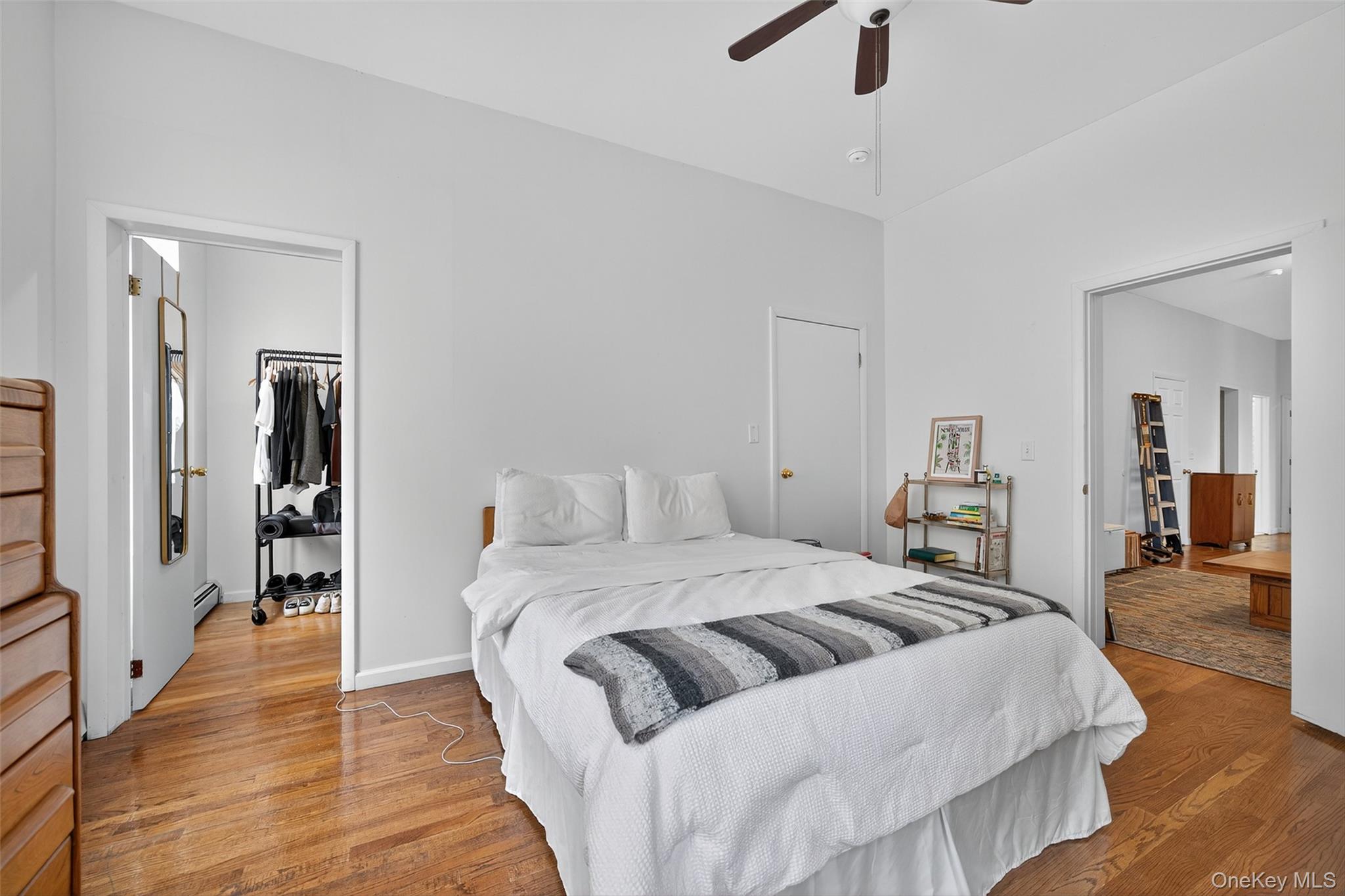 153 Lander Street Newburgh, NY 12550 - Photo 31 of 39 a bedroom with a large bed and a chandelier