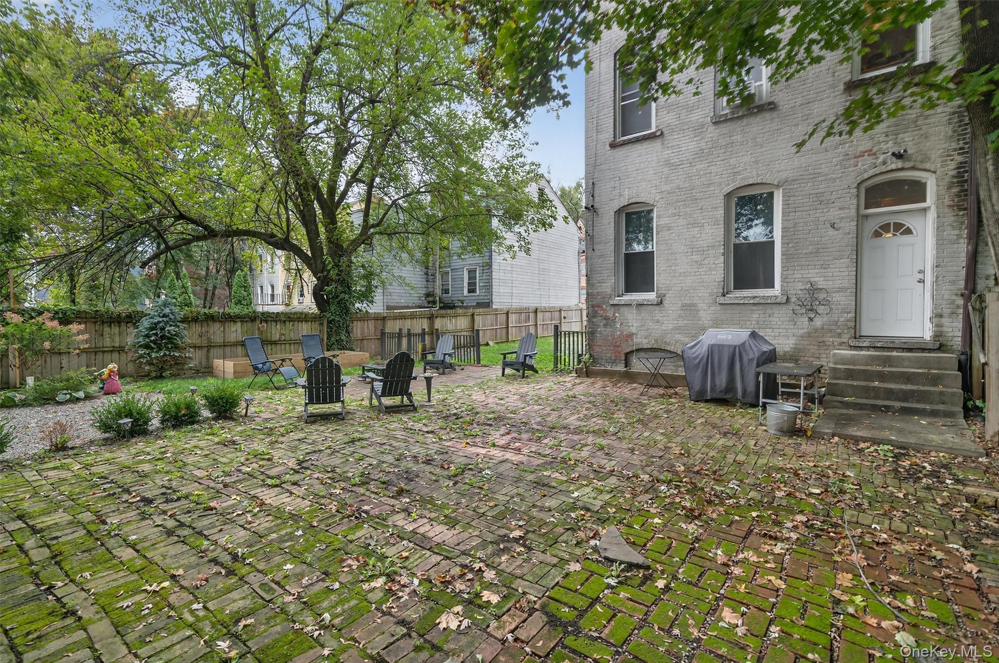 153 Lander Street Newburgh, NY 12550 - Photo 36 of 39 a view of a yard with plants and large tree