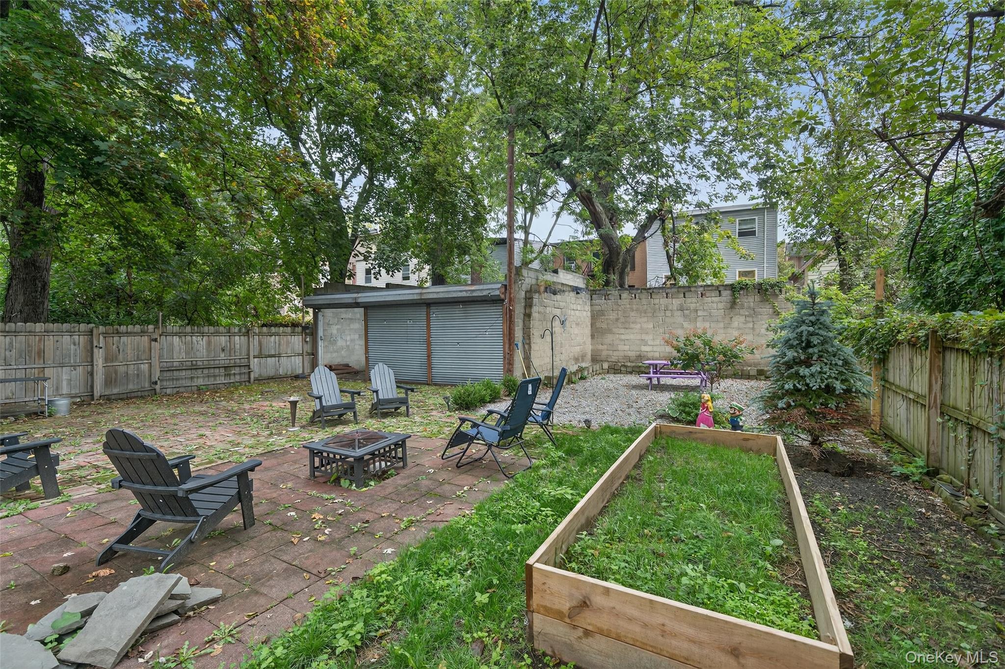 153 Lander Street Newburgh, NY 12550 - Photo 5 of 39 a view of backyard with seating space and trees