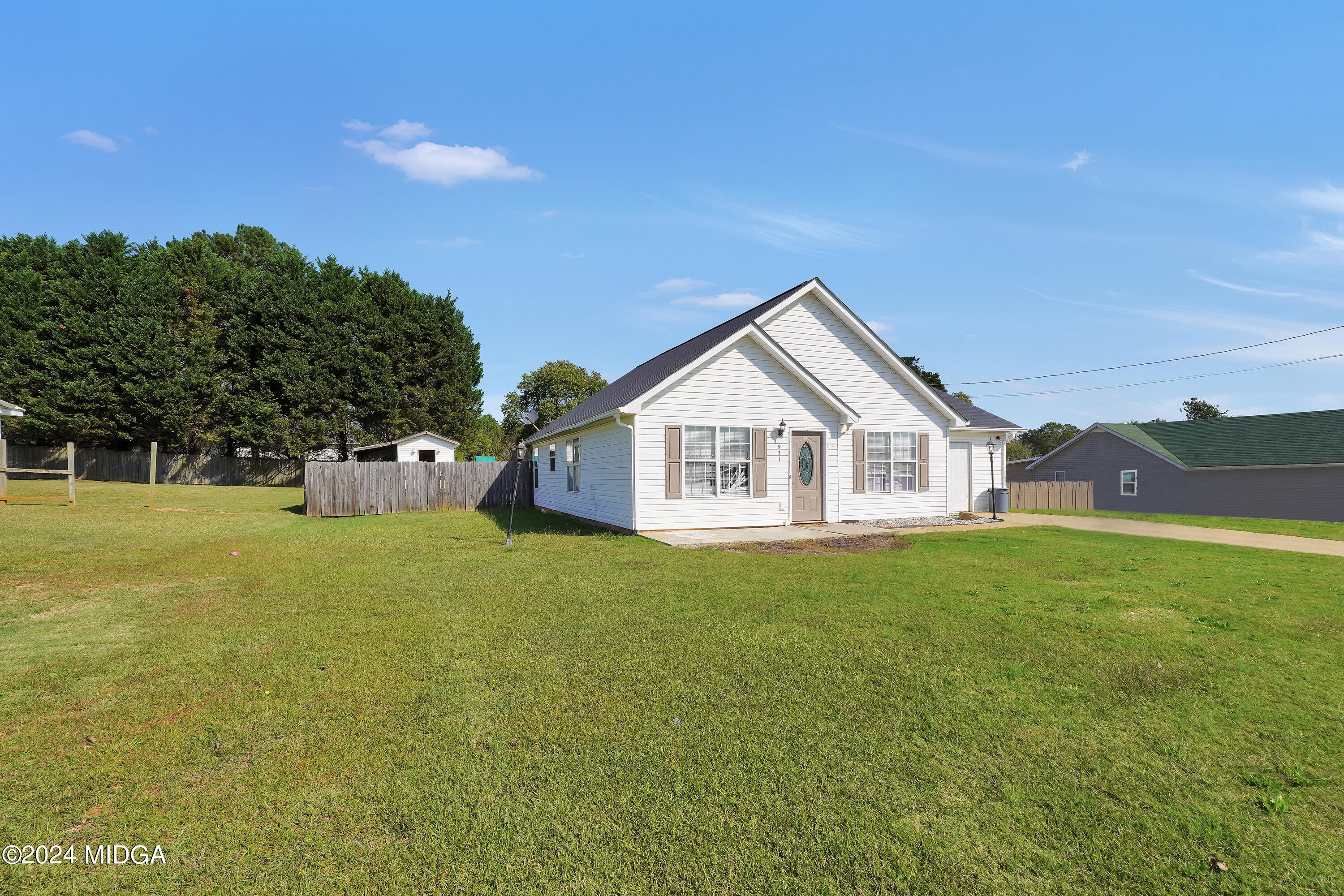 571 Regal Road Jackson, GA 30233 - Photo 3 of 21 a view of a house with a yard and garage