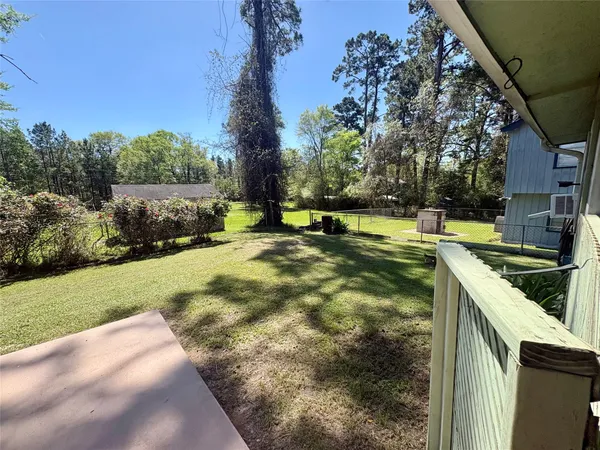 a view of a yard with an outdoor space