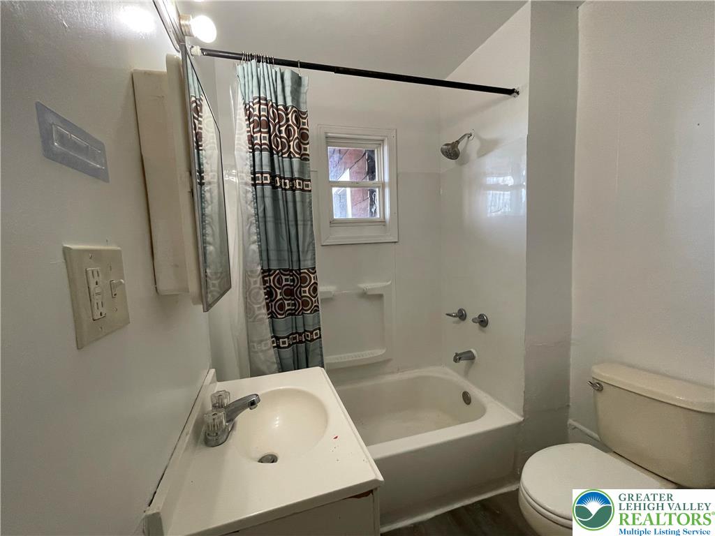 636 Ridge Avenue Allentown, PA 18102 - Photo 7 of 10 a bathroom with a sink a toilet and shower