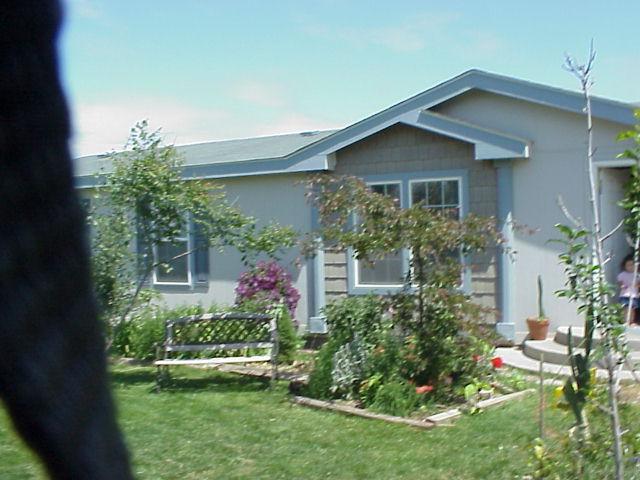 931 Lester Road South Outlook, WA 98938 - Photo 1 of 8 a front view of a house with a yard