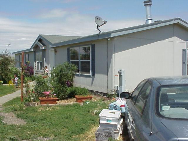 931 Lester Road South Outlook, WA 98938 - Photo 2 of 8 a front view of a house with garden