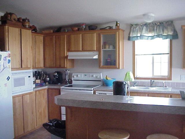 931 Lester Road South Outlook, WA 98938 - Photo 5 of 8 a kitchen with a sink a window and cabinets