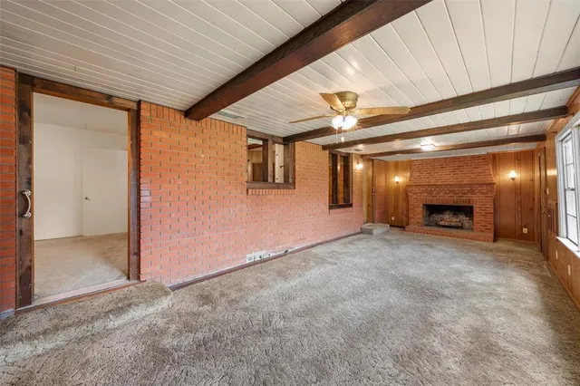 a view of an empty room with a fireplace