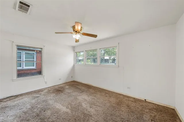 a view of empty room with windows