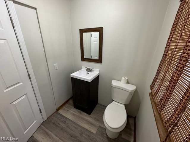 997 Berwin Street Akron, OH 44310 - Photo 4 of 34 Bathroom featuring vanity, mirror, and dark hardwood flooring