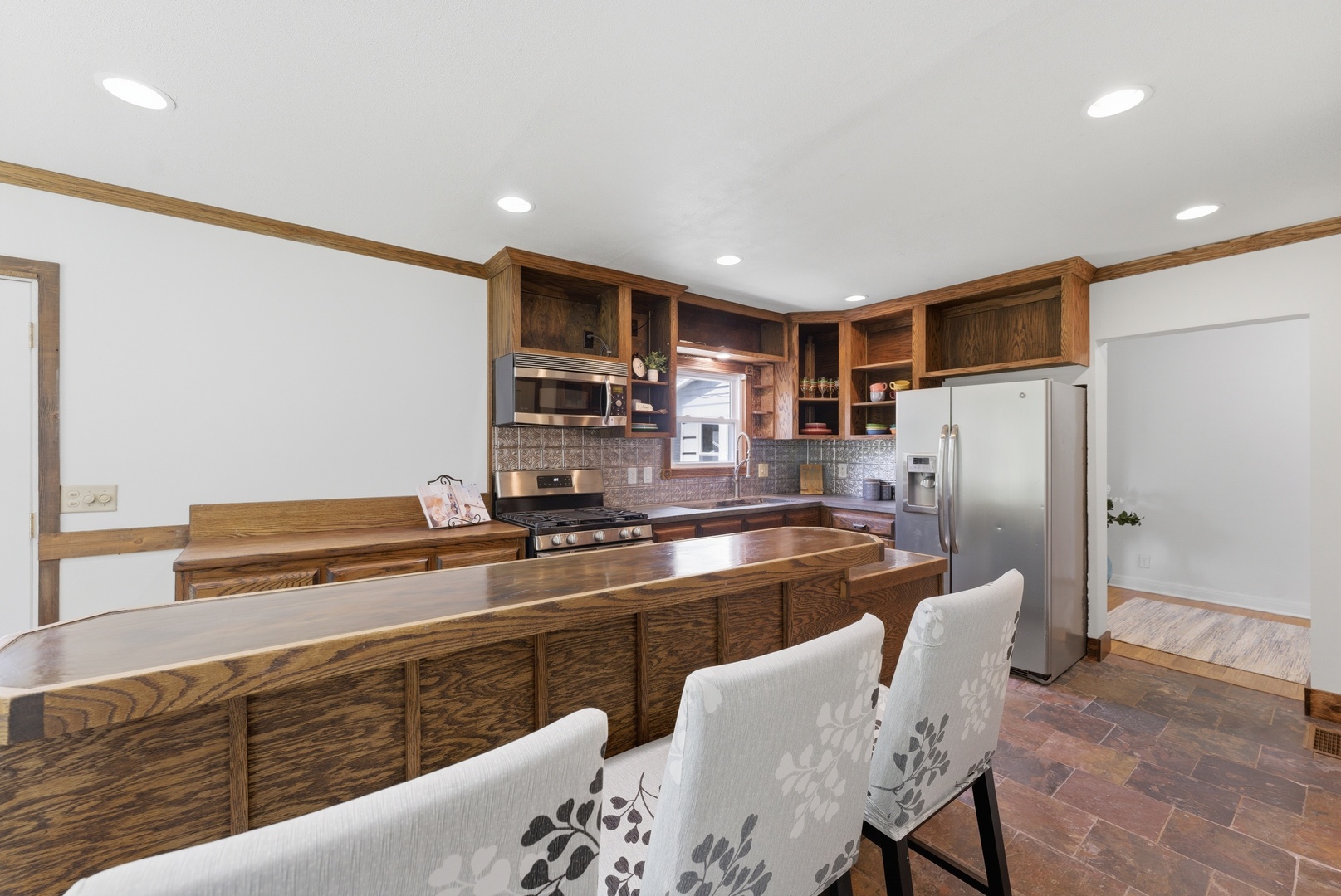 2405 31st Street Moline, IL 61265 - Photo 16 of 24 a kitchen with stainless steel appliances granite countertop a refrigerator and a stove top oven