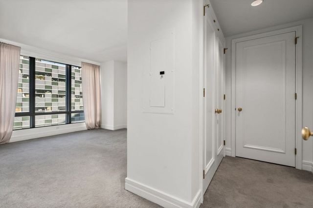 a view of a hallway with closet