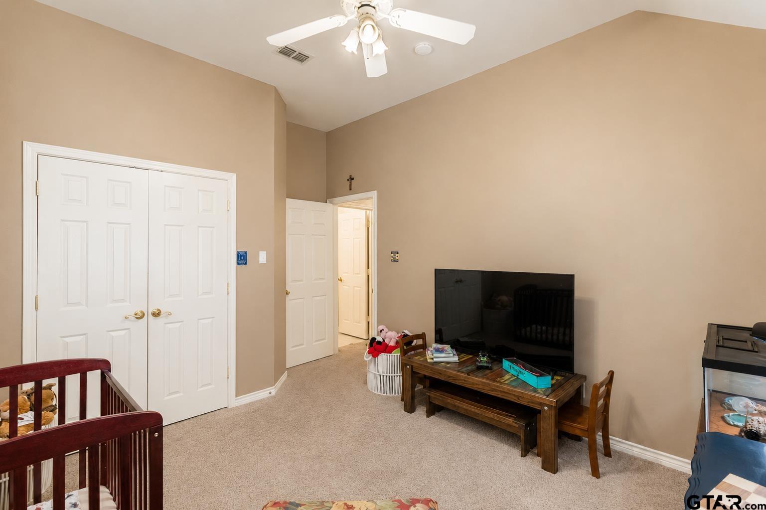 1388 Santa Fe Trail Tyler, TX 75703 - Photo 37 of 46 a living room with furniture and a flat screen tv
