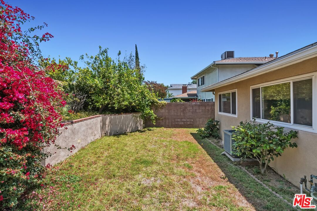 19131 Tulsa Street Porter Ranch, CA 91326 - Photo 32 of 43 a view of a backyard with potted plants