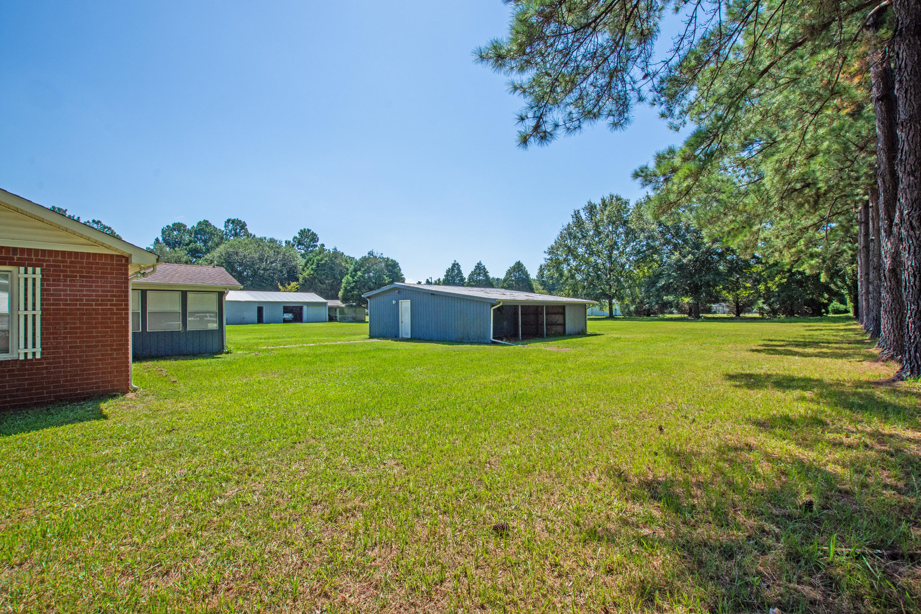 834 Van Dyke Road Cottageville, SC 29435 - Photo 7 of 26 backyard garage-shop with car port