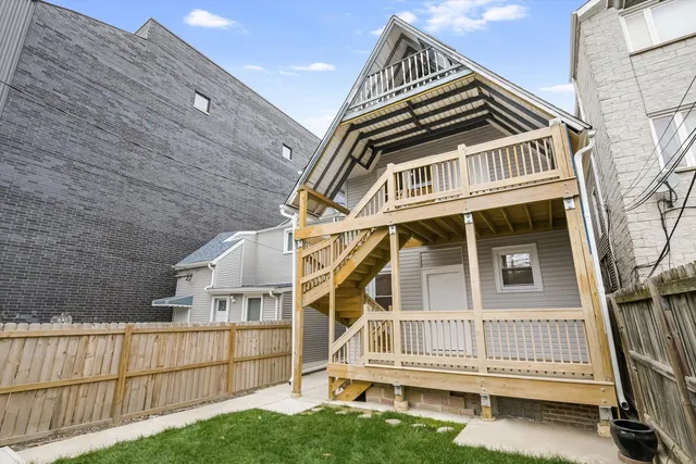 a view of a house with a small yard