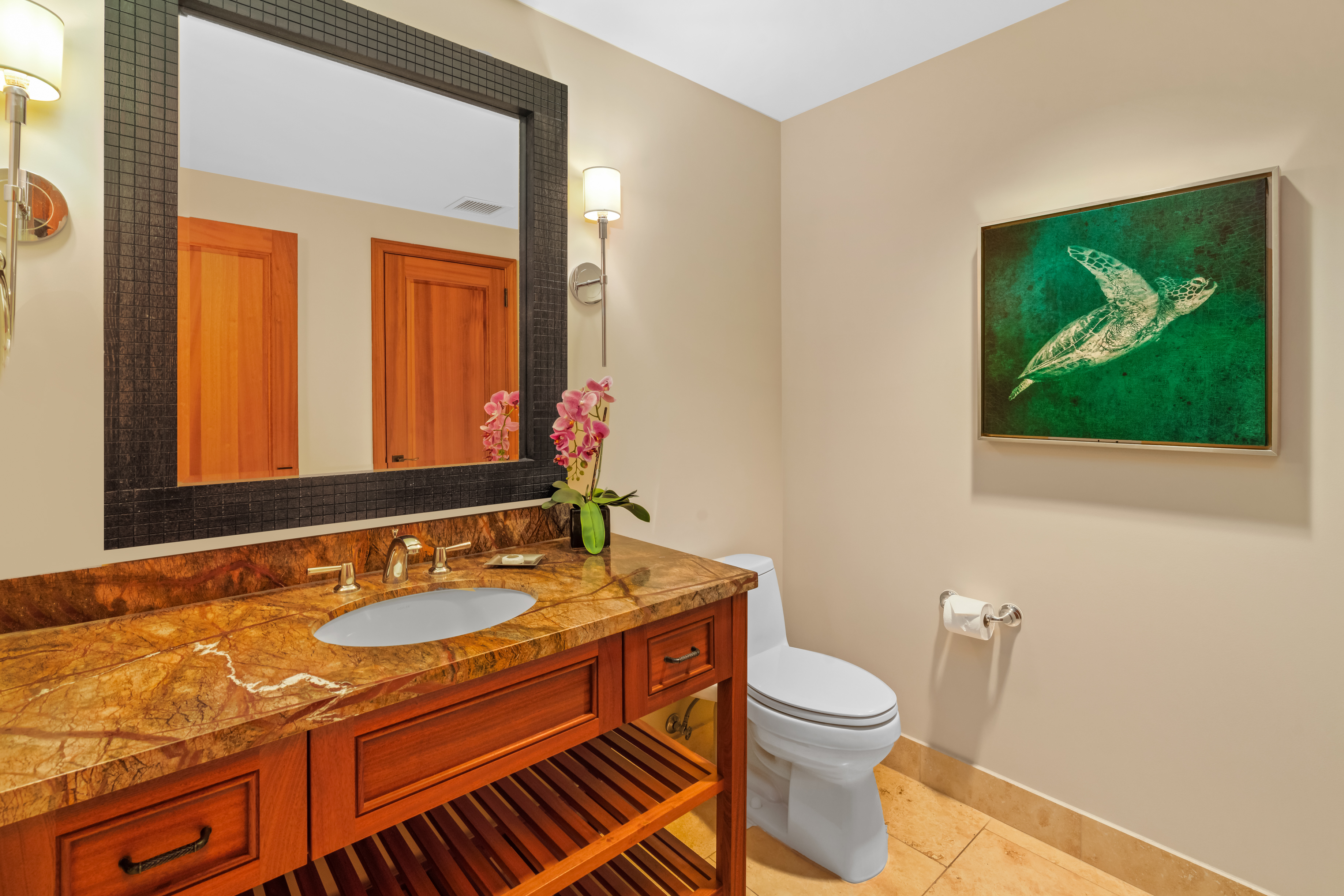 2641 Poipu Road, Unit 1202 Koloa, HI 96756 - Photo 11 of 30 a bathroom with a toilet a sink and mirror