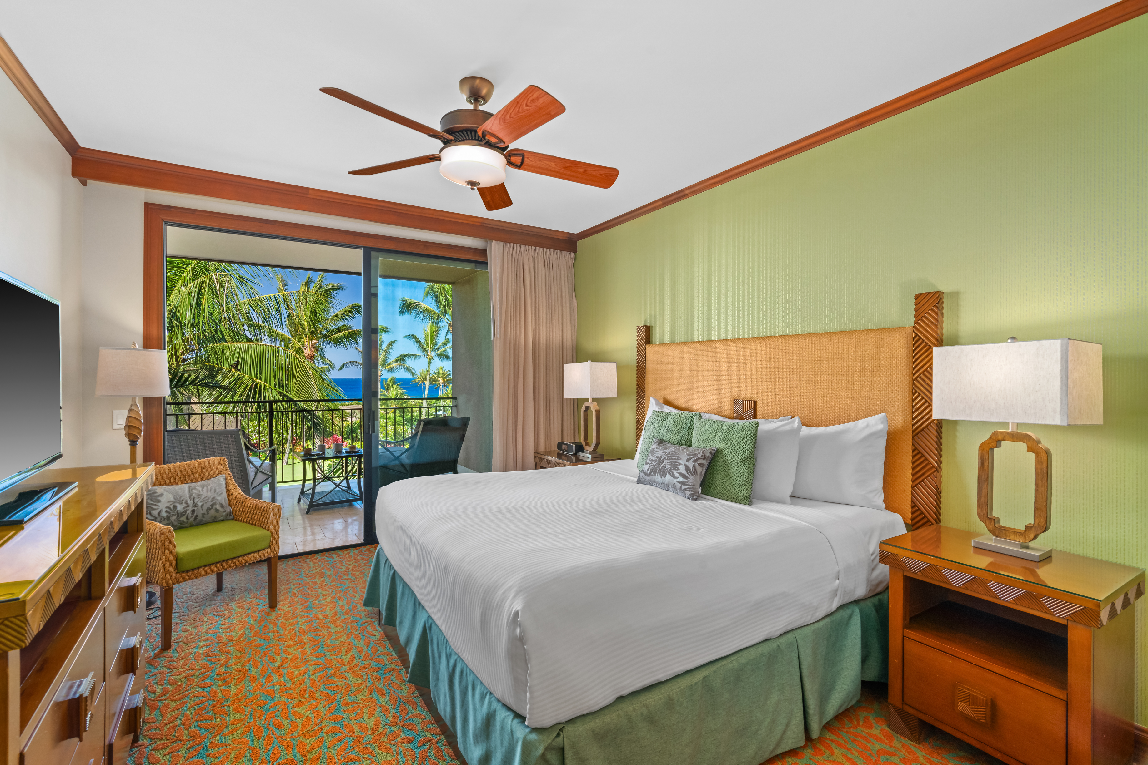 2641 Poipu Road, Unit 1202 Koloa, HI 96756 - Photo 14 of 30 a bedroom with a bed and a chandelier