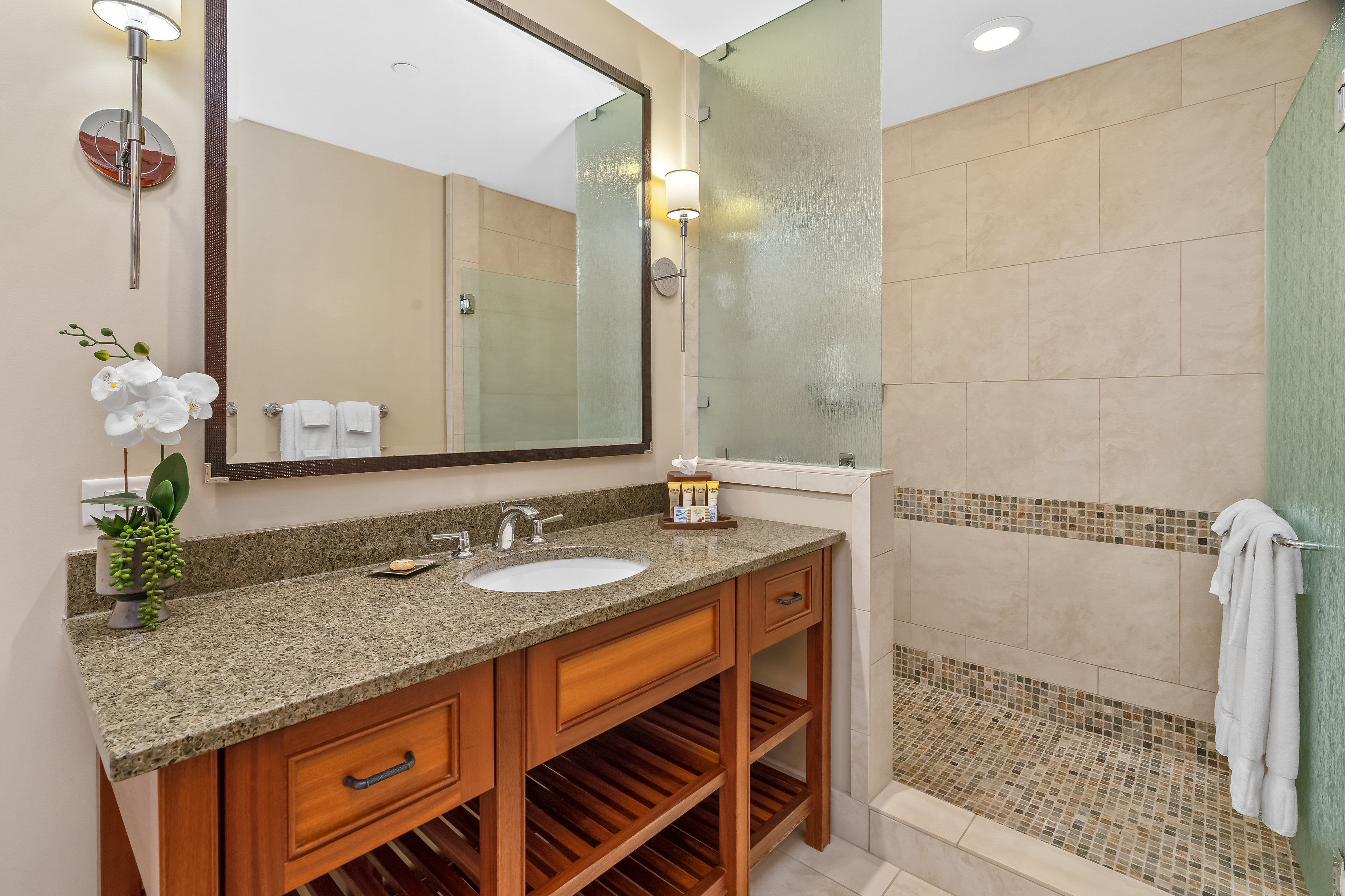 2641 Poipu Road, Unit 1202 Koloa, HI 96756 - Photo 17 of 30 a bathroom with a granite countertop sink and a mirror