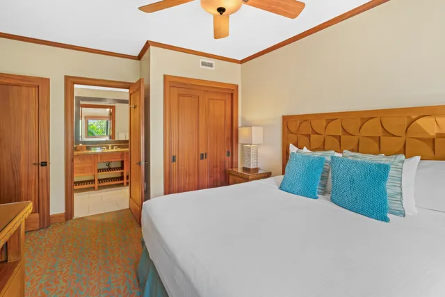 a bedroom with a bed and a view of bathroom