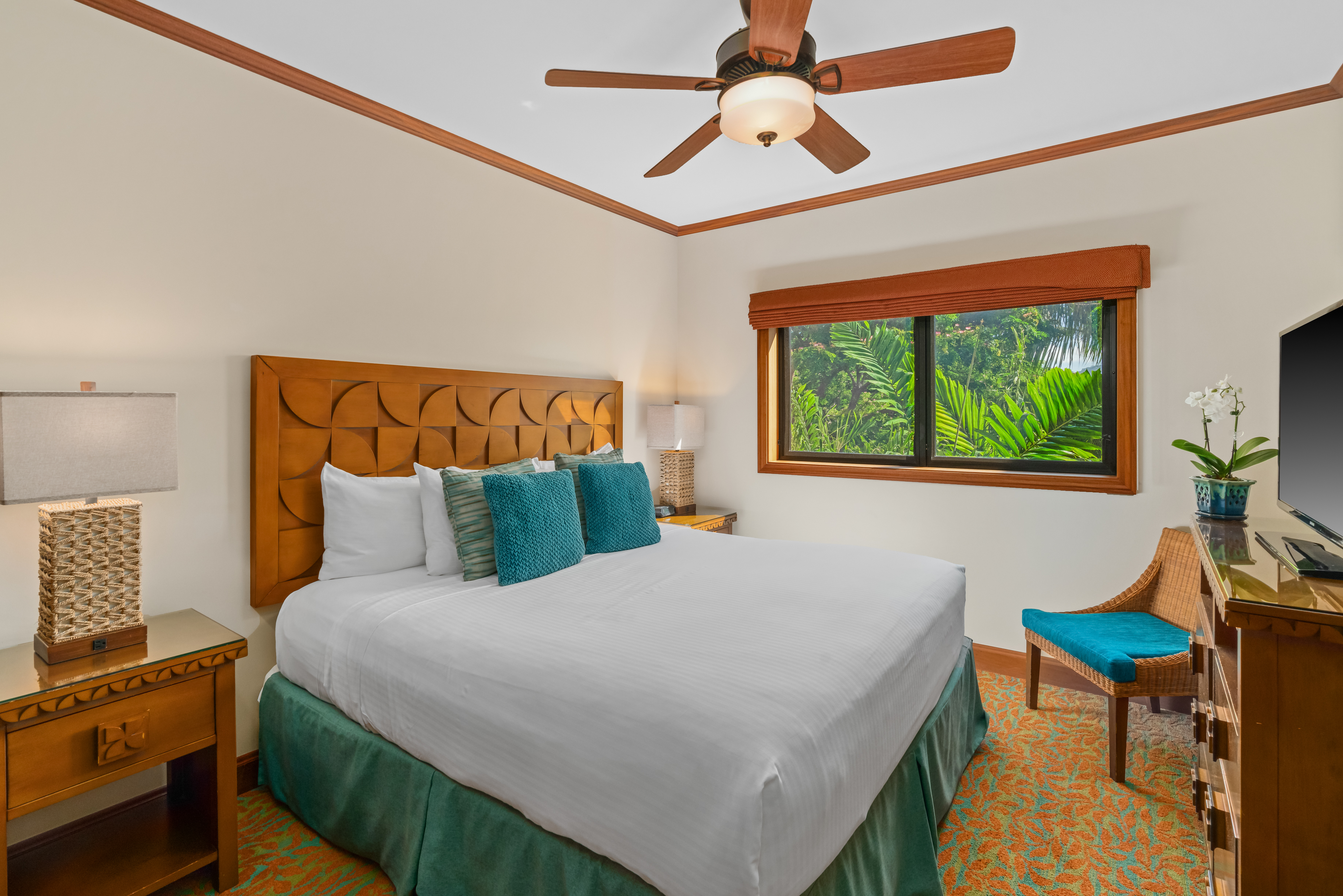 2641 Poipu Road, Unit 1202 Koloa, HI 96756 - Photo 19 of 30 a bedroom with a bed a desk and chair