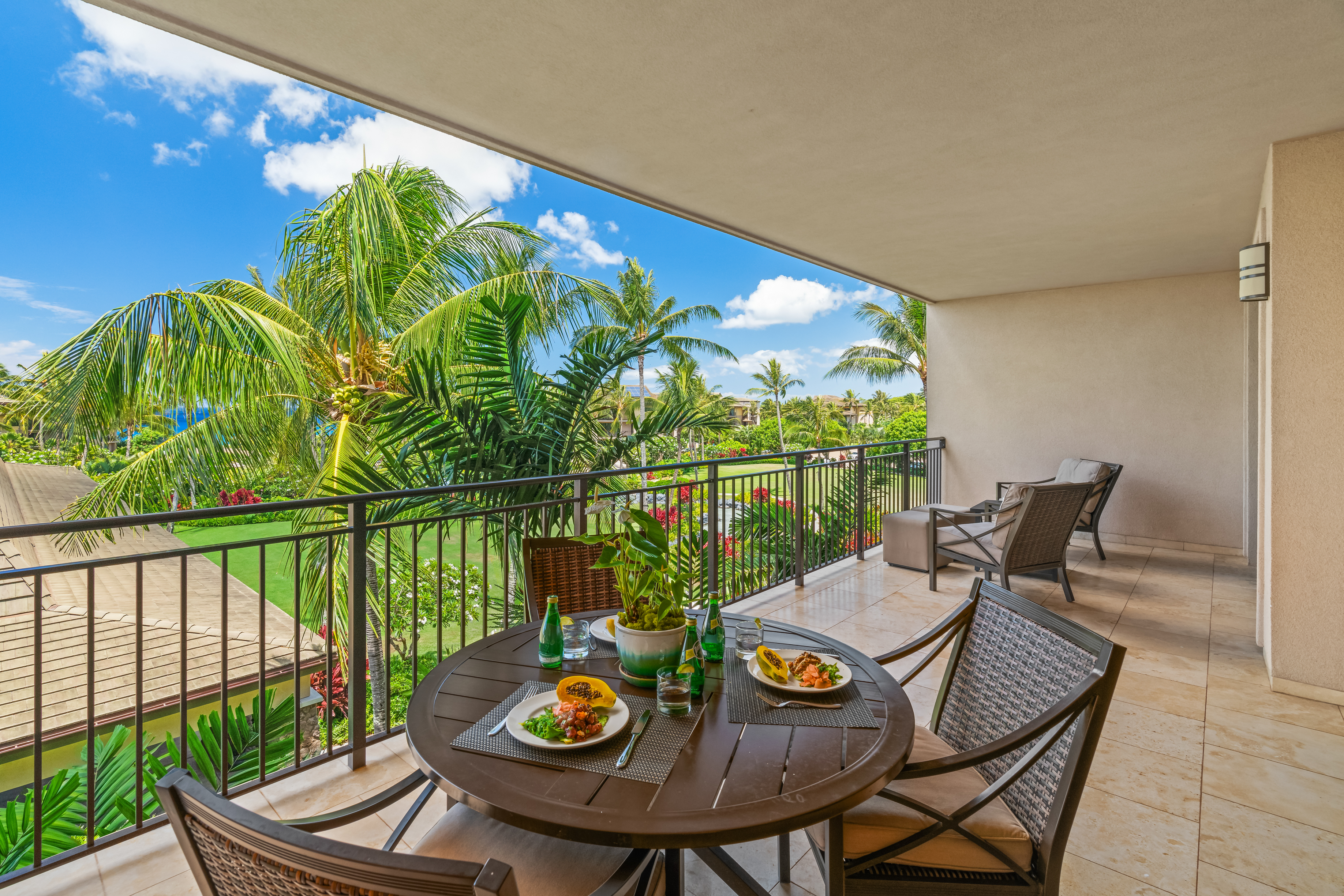 2641 Poipu Road, Unit 1202 Koloa, HI 96756 - Photo 21 of 30 a view of a balcony with chair and potted plants