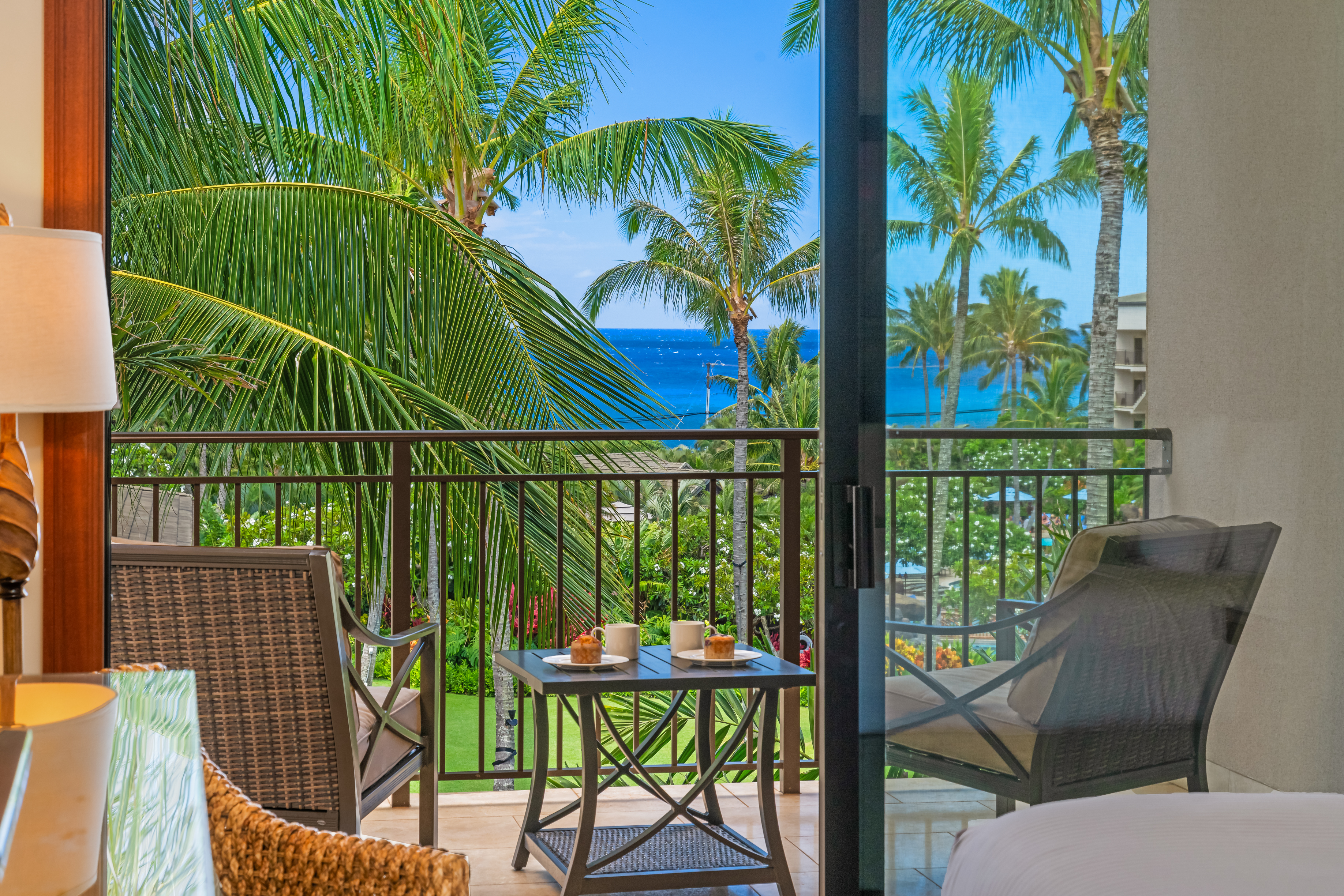 2641 Poipu Road, Unit 1202 Koloa, HI 96756 - Photo 22 of 30 a view of a chair and table in patio