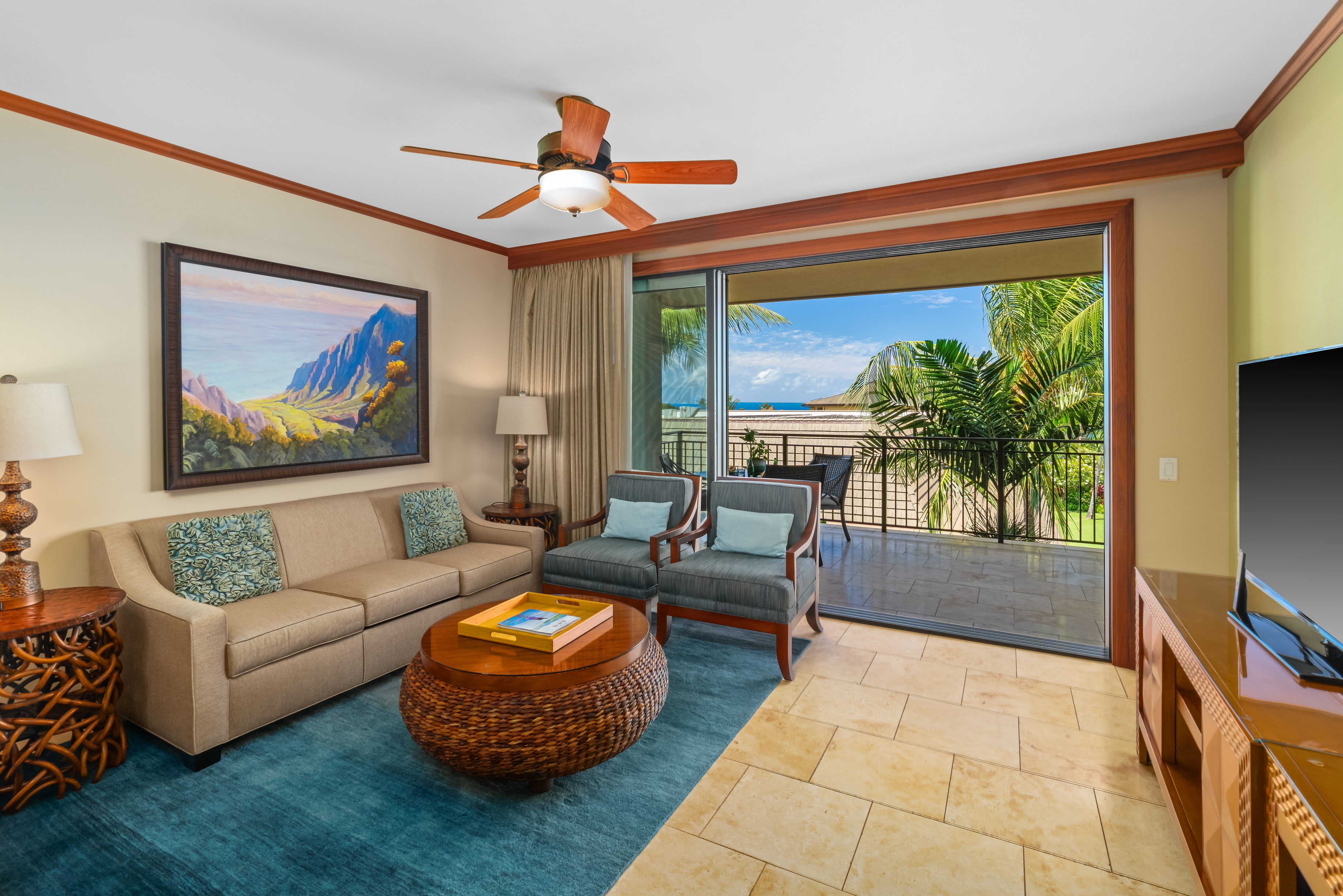 2641 Poipu Road, Unit 1202 Koloa, HI 96756 - Photo 4 of 30 a living room with furniture and a flat screen tv