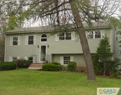 2 Highpoint Drive Edison, NJ 08820 - Photo 1 of 7 a front view of a house with a garden