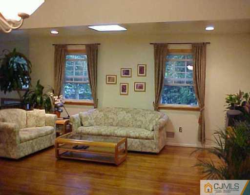 2 Highpoint Drive Edison, NJ 08820 - Photo 5 of 7 a living room with furniture and a window