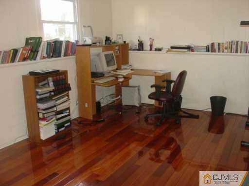 2 Highpoint Drive Edison, NJ 08820 - Photo 6 of 7 a view of a workspace with furniture and a potted plant