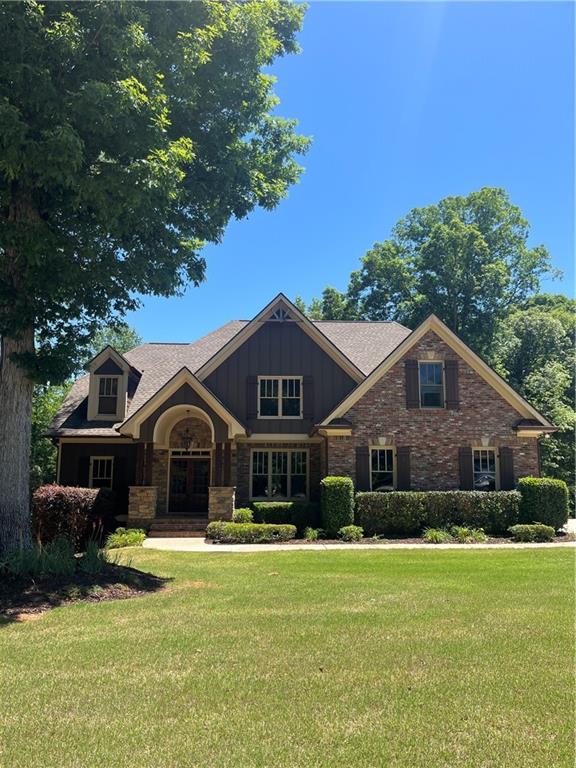 348 Hidden Trail Pendergrass, GA 30567 - Photo 1 of 40 a front view of a house with a garden