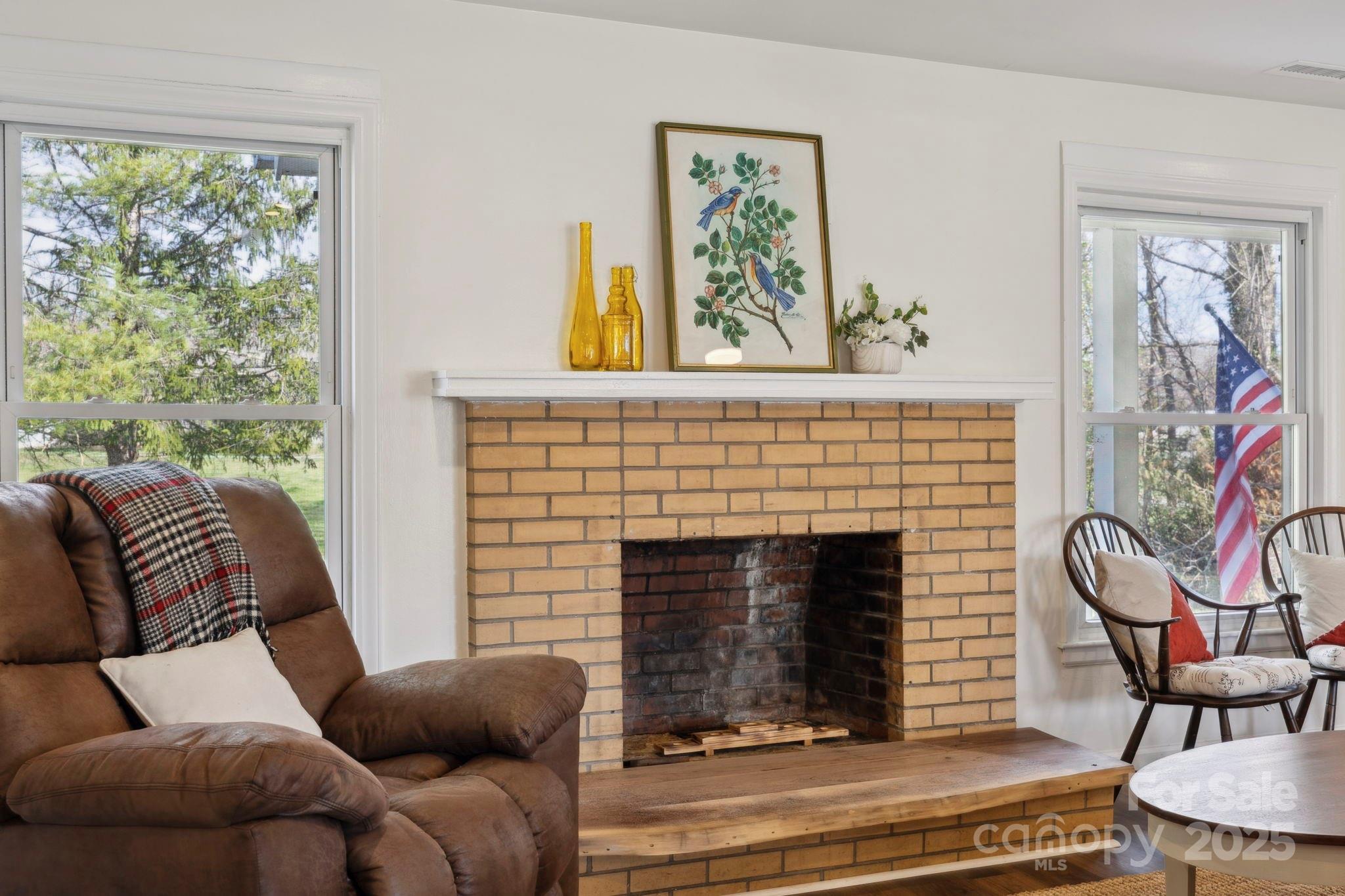 1450 Cane Creek Road Fletcher, NC 28732 - Photo 13 of 36 a living room with furniture and a fireplace