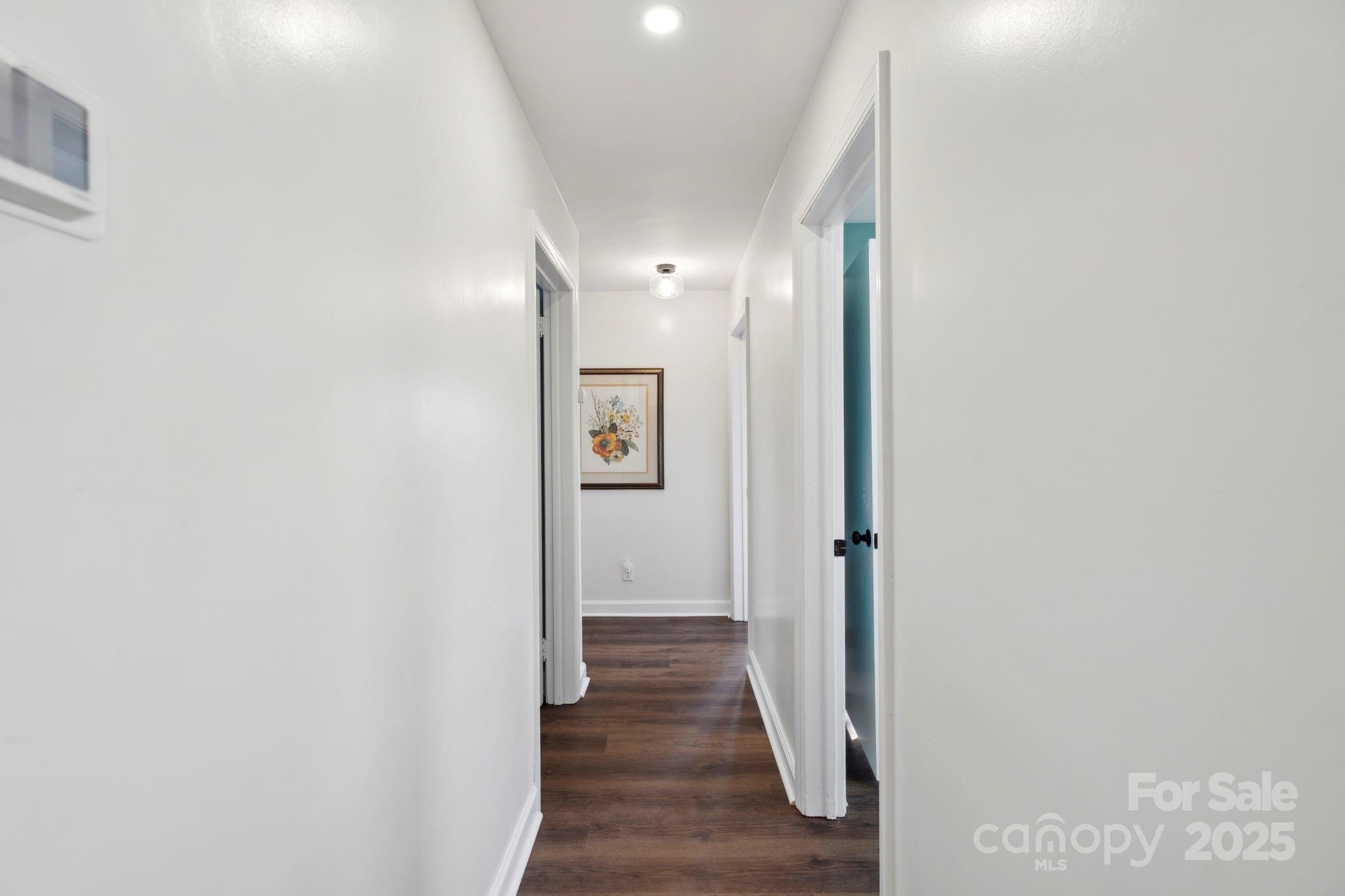 1450 Cane Creek Road Fletcher, NC 28732 - Photo 16 of 36 a view of a hallway with wooden floor