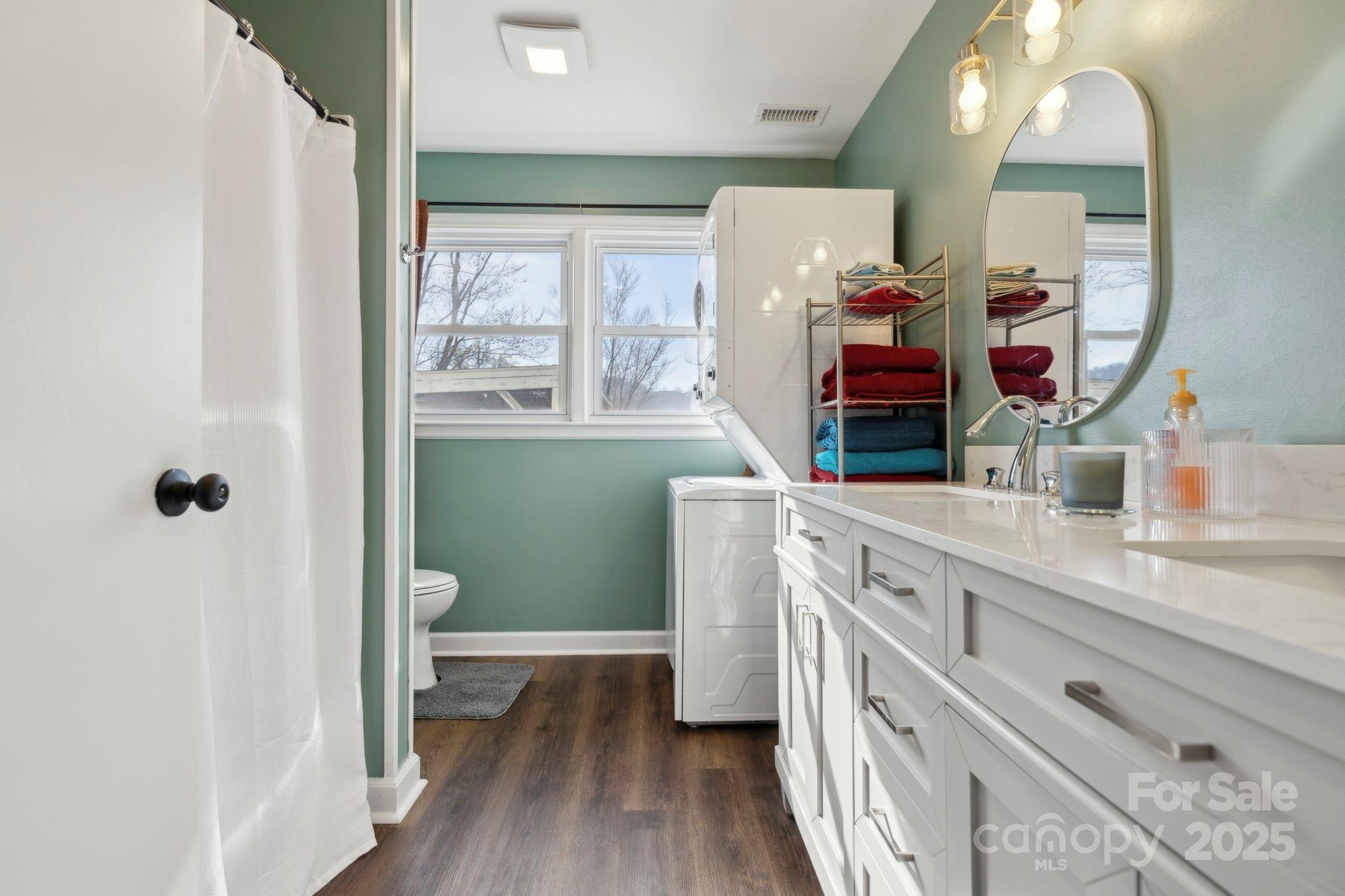 1450 Cane Creek Road Fletcher, NC 28732 - Photo 24 of 36 a bathroom with a granite countertop sink mirror and a toilet