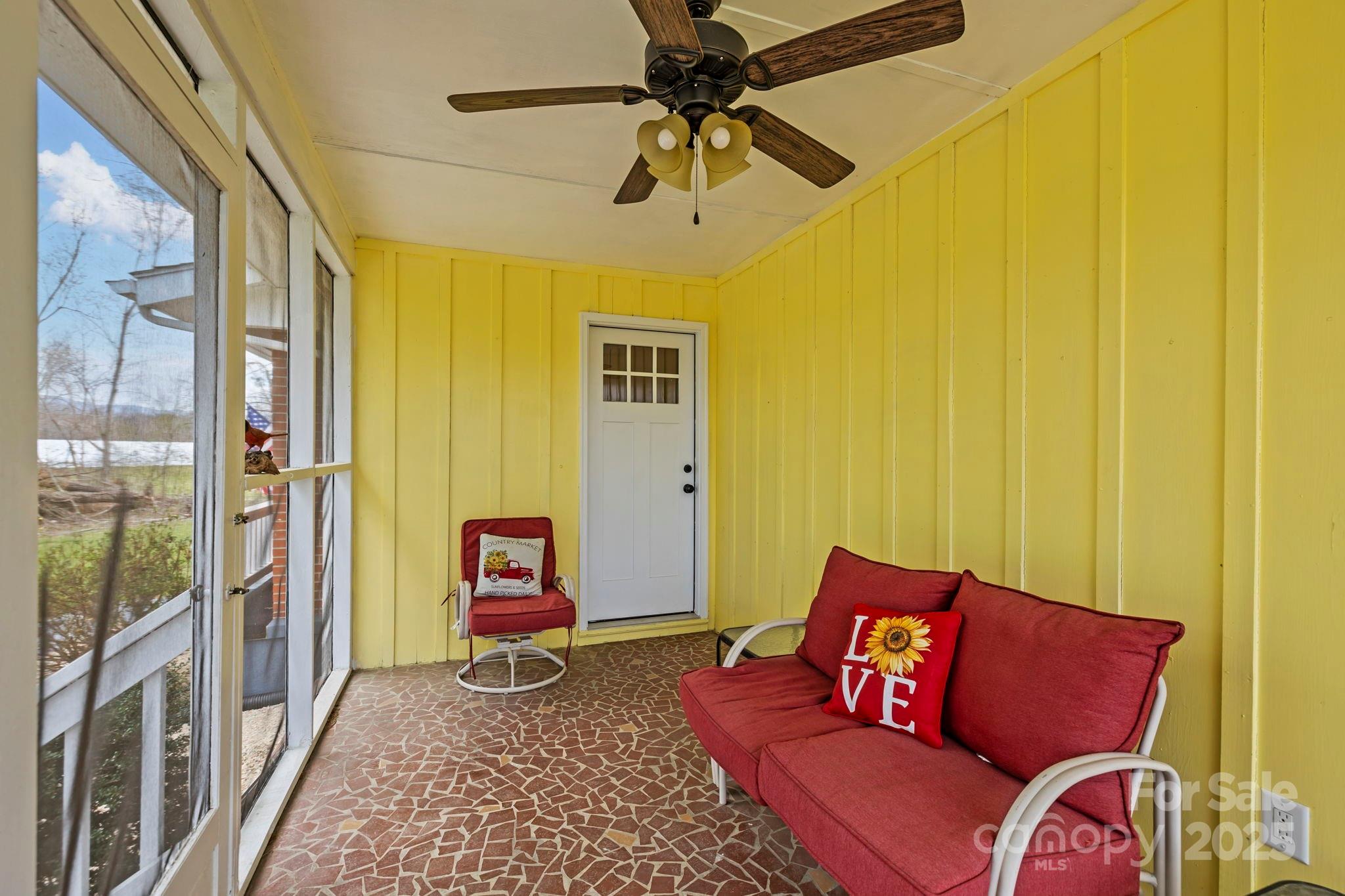 1450 Cane Creek Road Fletcher, NC 28732 - Photo 25 of 36 a bedroom with a bed and wooden floor