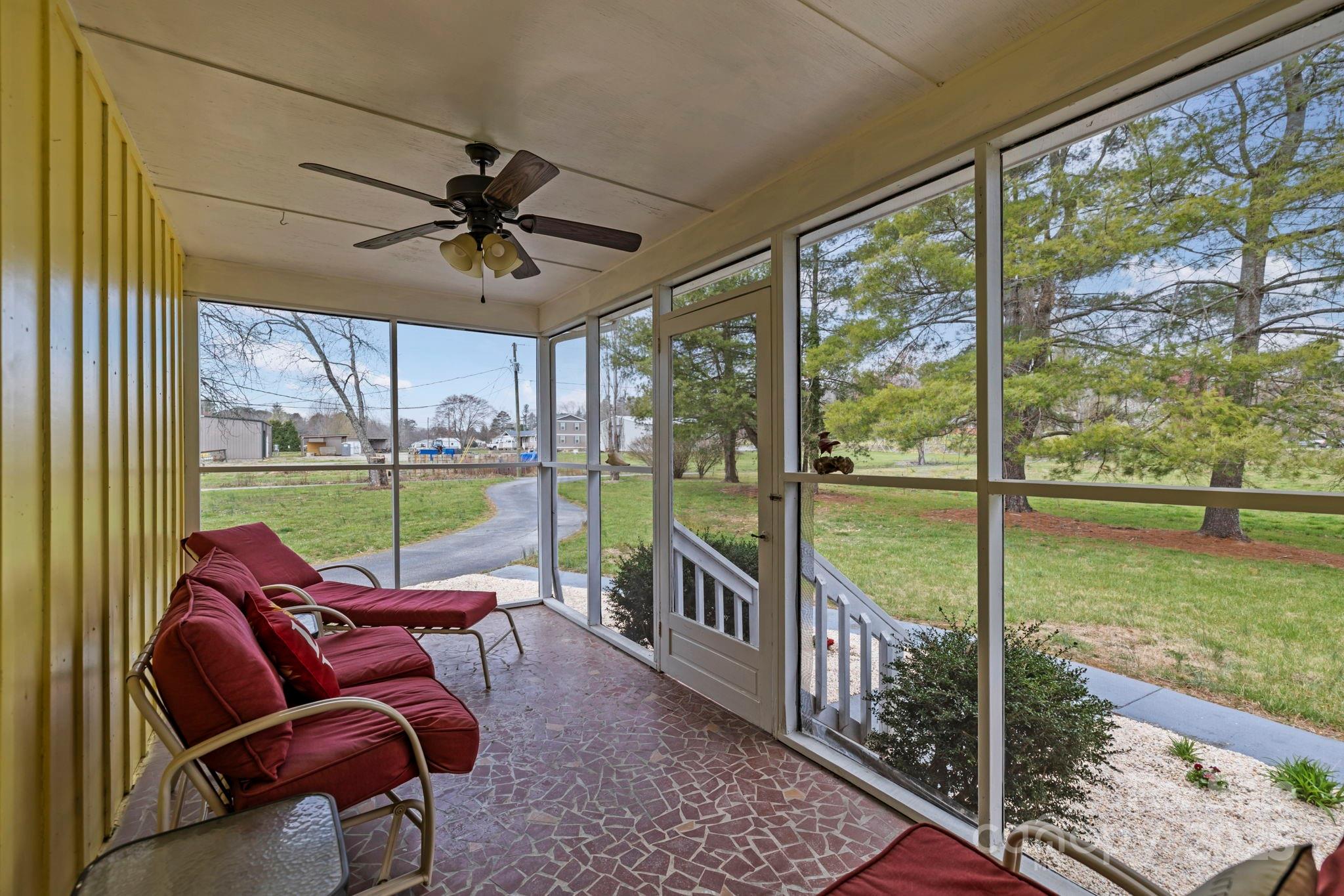 1450 Cane Creek Road Fletcher, NC 28732 - Photo 26 of 36 a living room with furniture and a floor to ceiling window