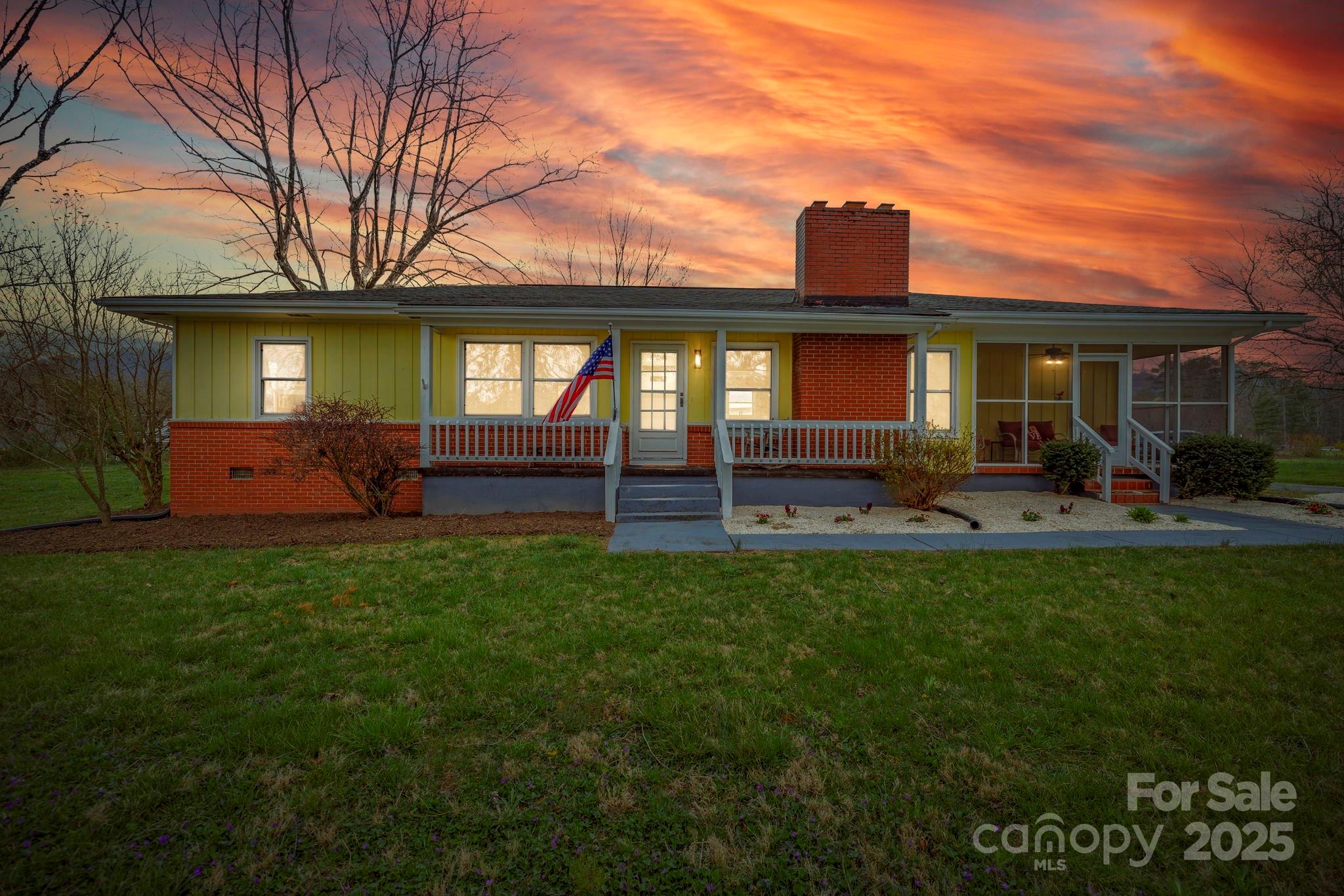 1450 Cane Creek Road Fletcher, NC 28732 - Photo 4 of 36 a front view of house with yard and outdoor seating