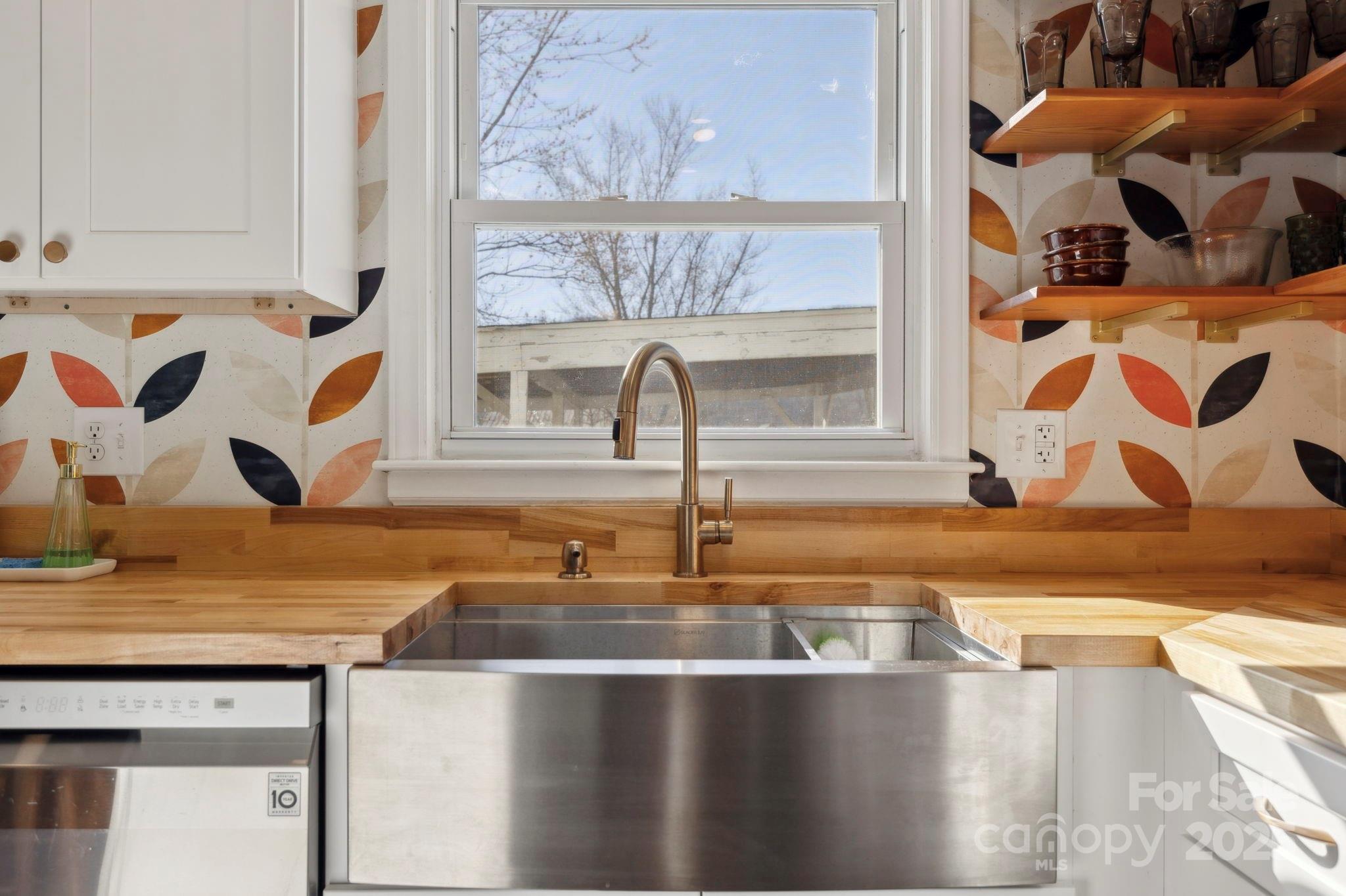 1450 Cane Creek Road Fletcher, NC 28732 - Photo 8 of 36 a kitchen with a sink and a window