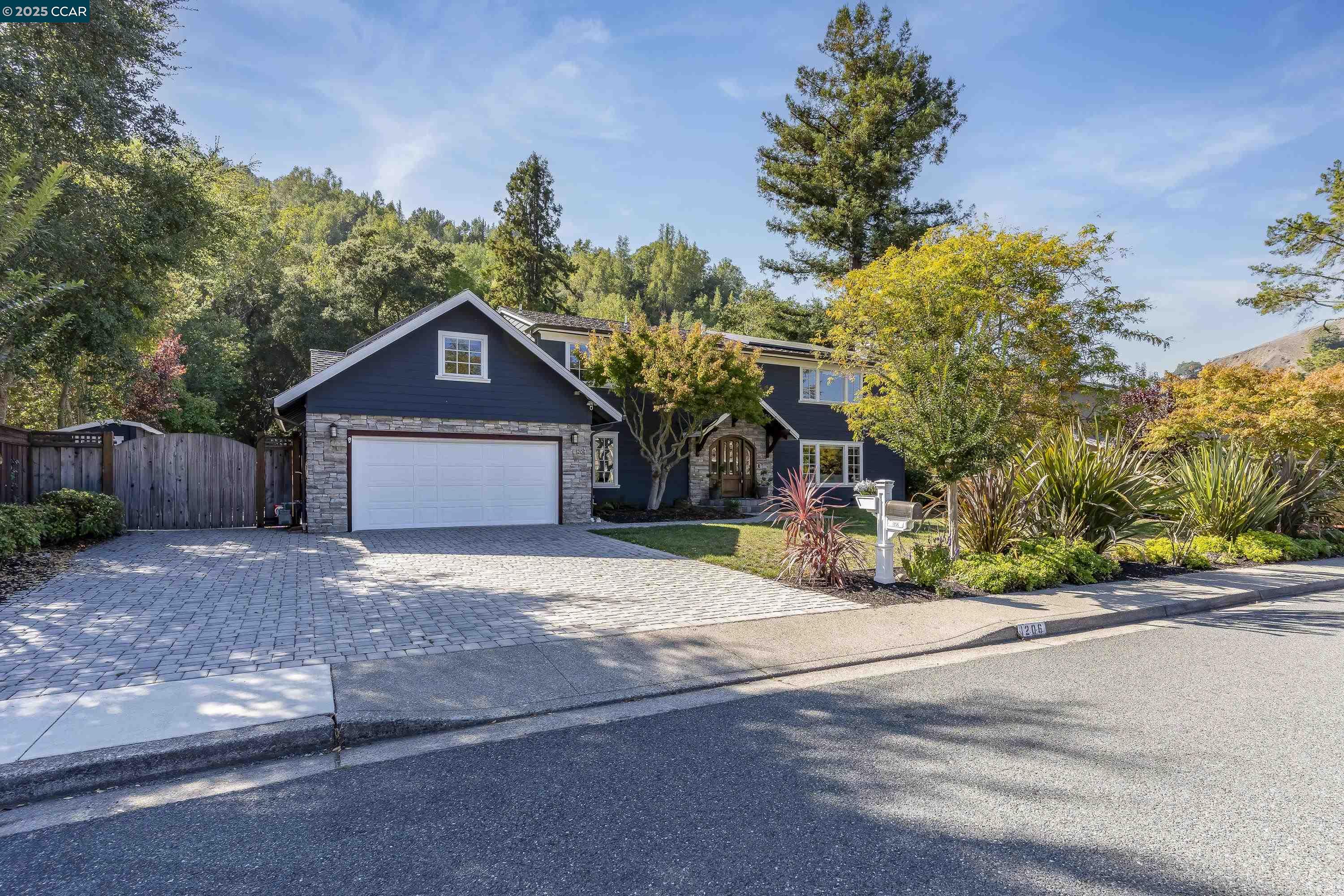 a view of a house with a yard and garage