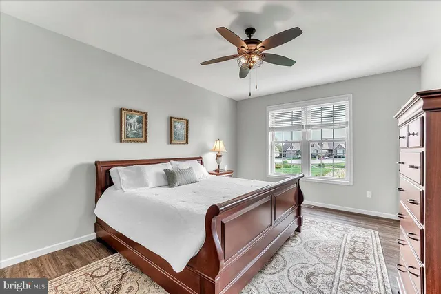 a bed room with a bed and a window