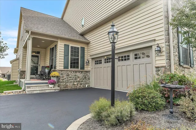 a front view of a house with stairs