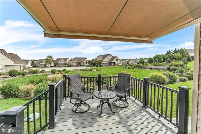 a view of a balcony with wooden floor and outdoor space