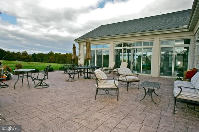 a view of a garden with an outdoor seating