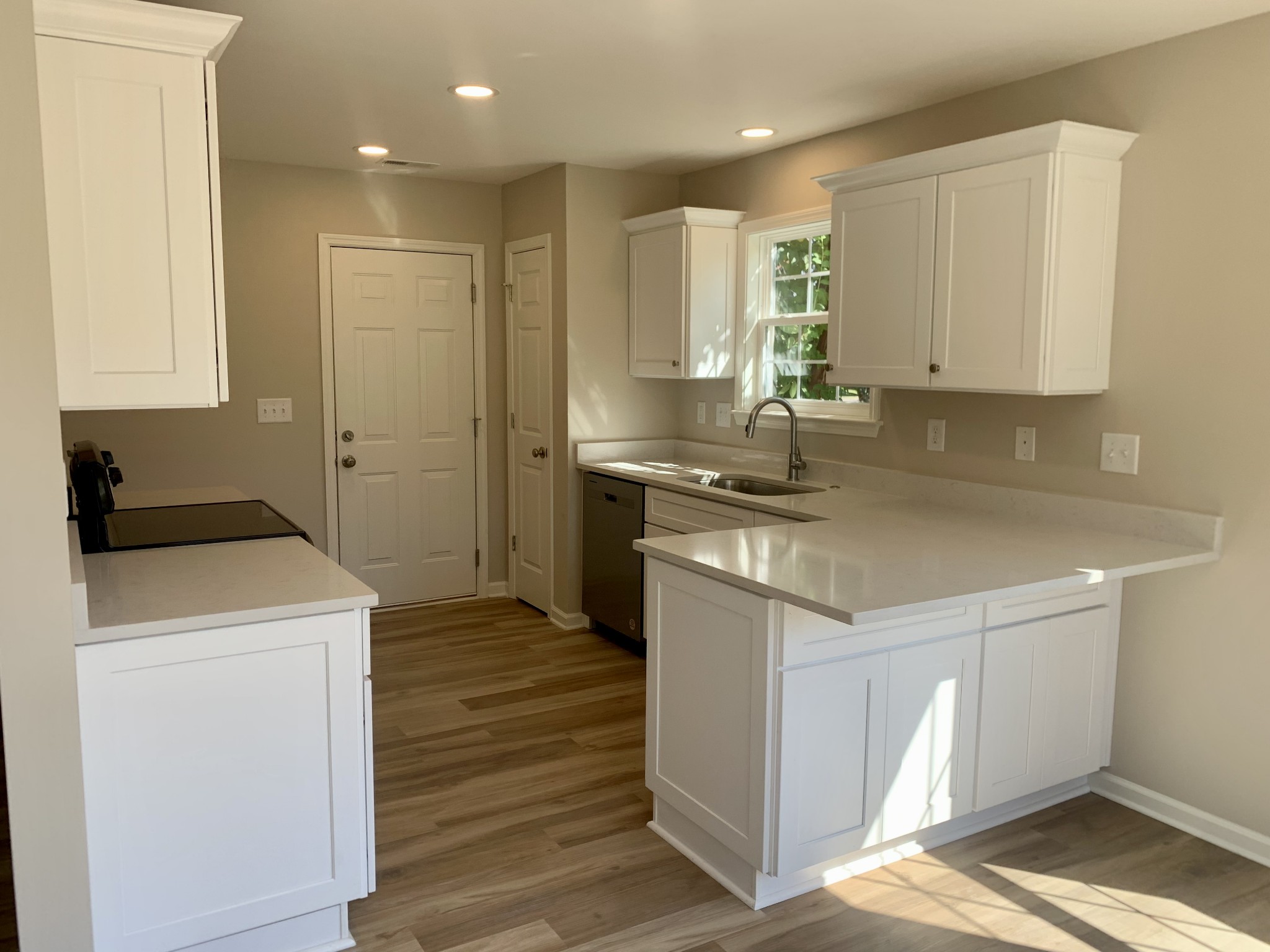 1897 Portway Road Spring Hill, TN 37174 - Photo 8 of 27 a kitchen with a sink stove and cabinets