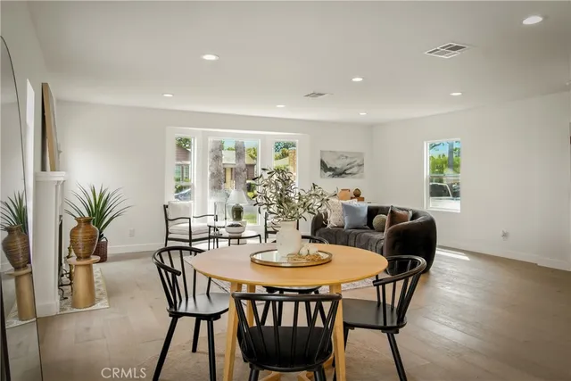 a kitchen with stainless steel appliances a stove a sink cabinets and a refrigerator