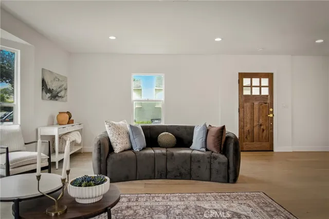 a kitchen with white cabinets and a stove
