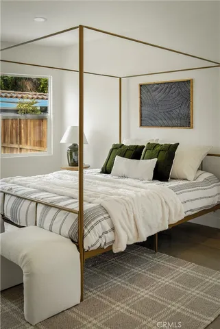 a bedroom with furniture and a window