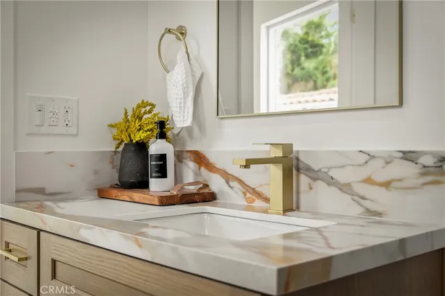 a bathroom with a toilet a sink and a shower