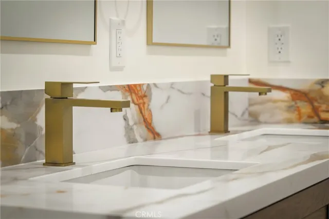 a close view of a bathroom shower and a sink